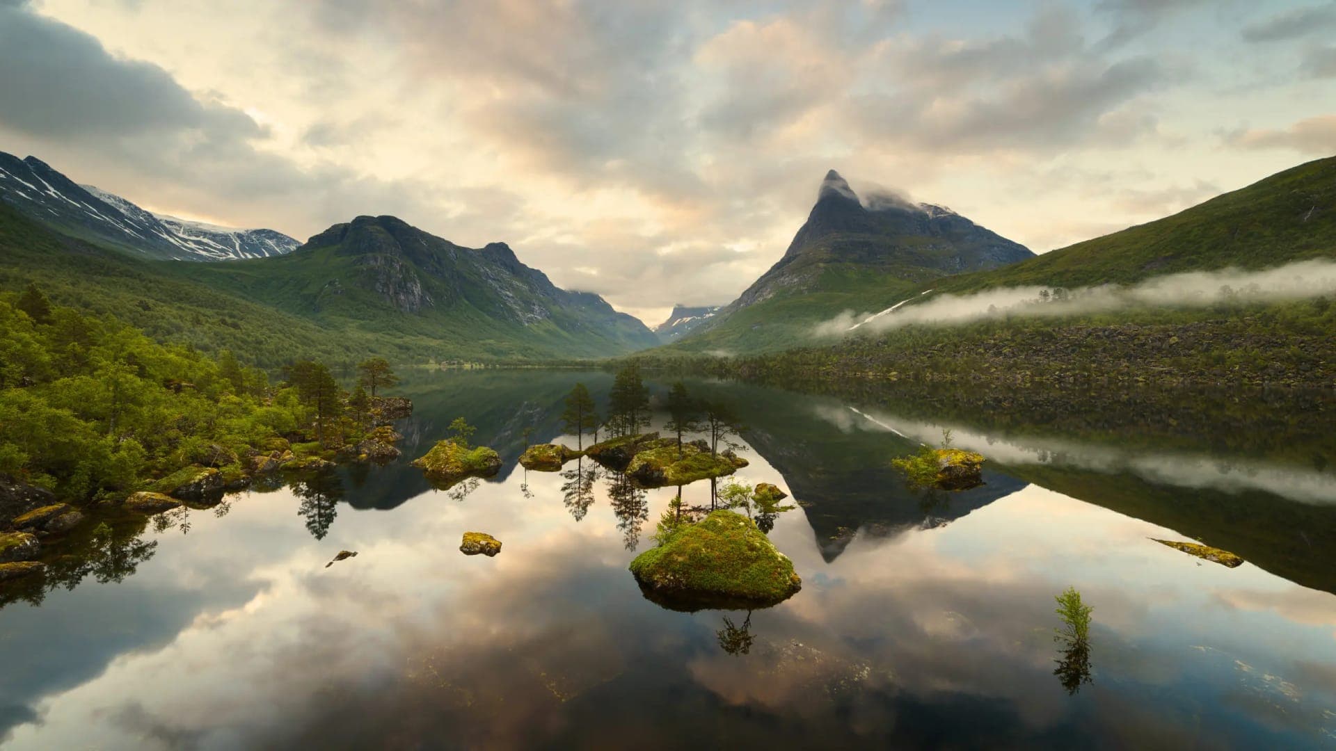 Mountain landscape with lake reflection at sunset