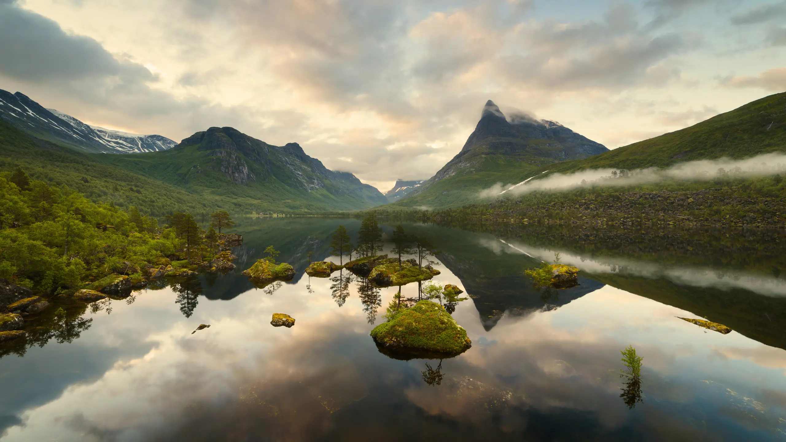 Mountain landscape with lake reflection at sunset